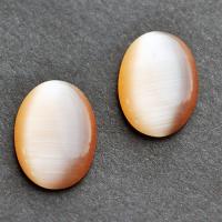 Kocie oko kaboszon 18 x 13 mm brzoskwiniowy Kocie oko kaboszon 18 x 13 mm brzoskwiniowy